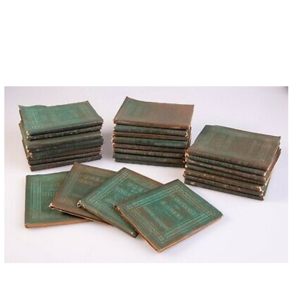 Little leather library of 27 books from the 1920's.